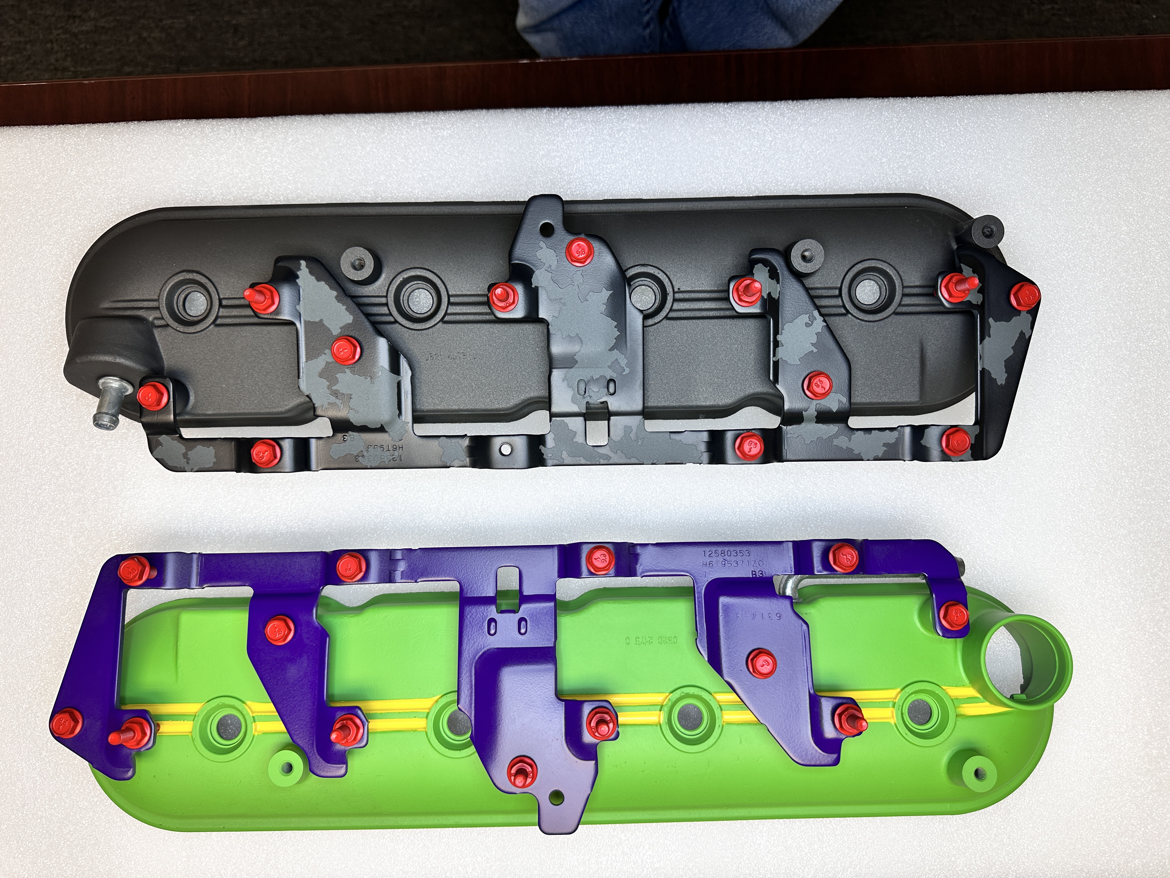 Valve covers before and after Cerakote — stock versus Batman and Joker theme