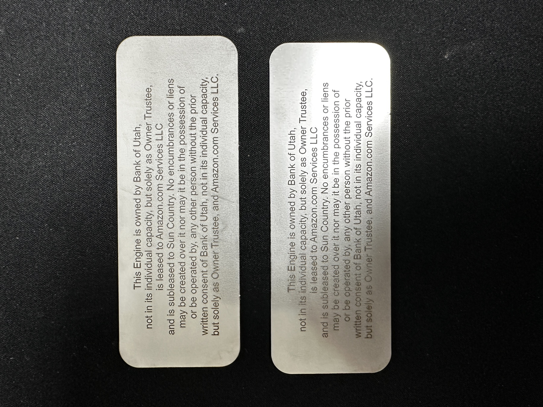 Two matching Bank of Utah engine ownership plates side by side
